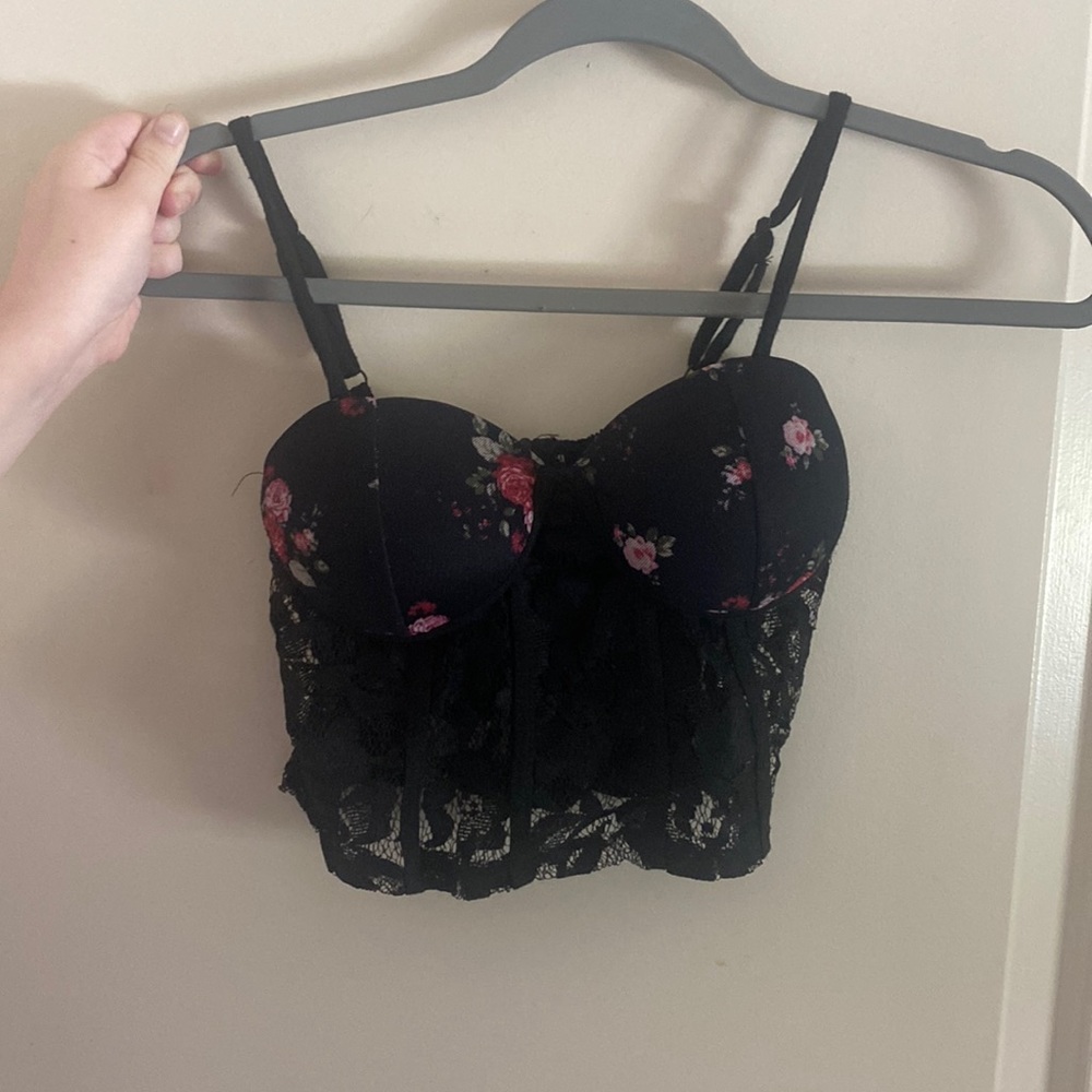 Black Corset brassiere with floral prints. Cupped bra and in size Small.